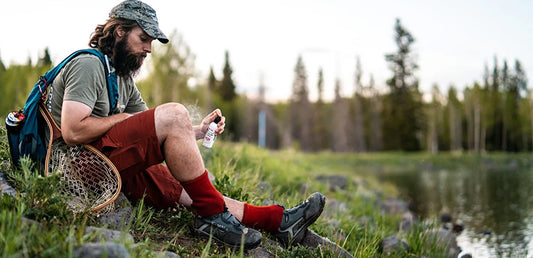 Man applying Tecnu Rash Relief to leg