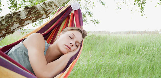 Woman sleeping in hammock