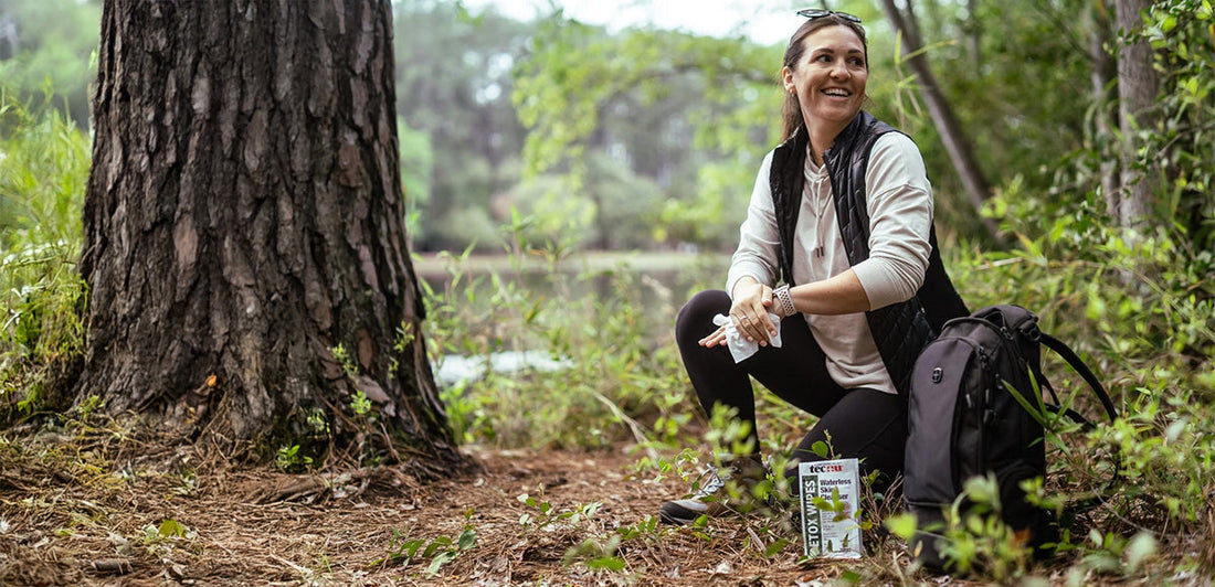 Woman removing poison ivy oil with Tecnu Detox Wipes